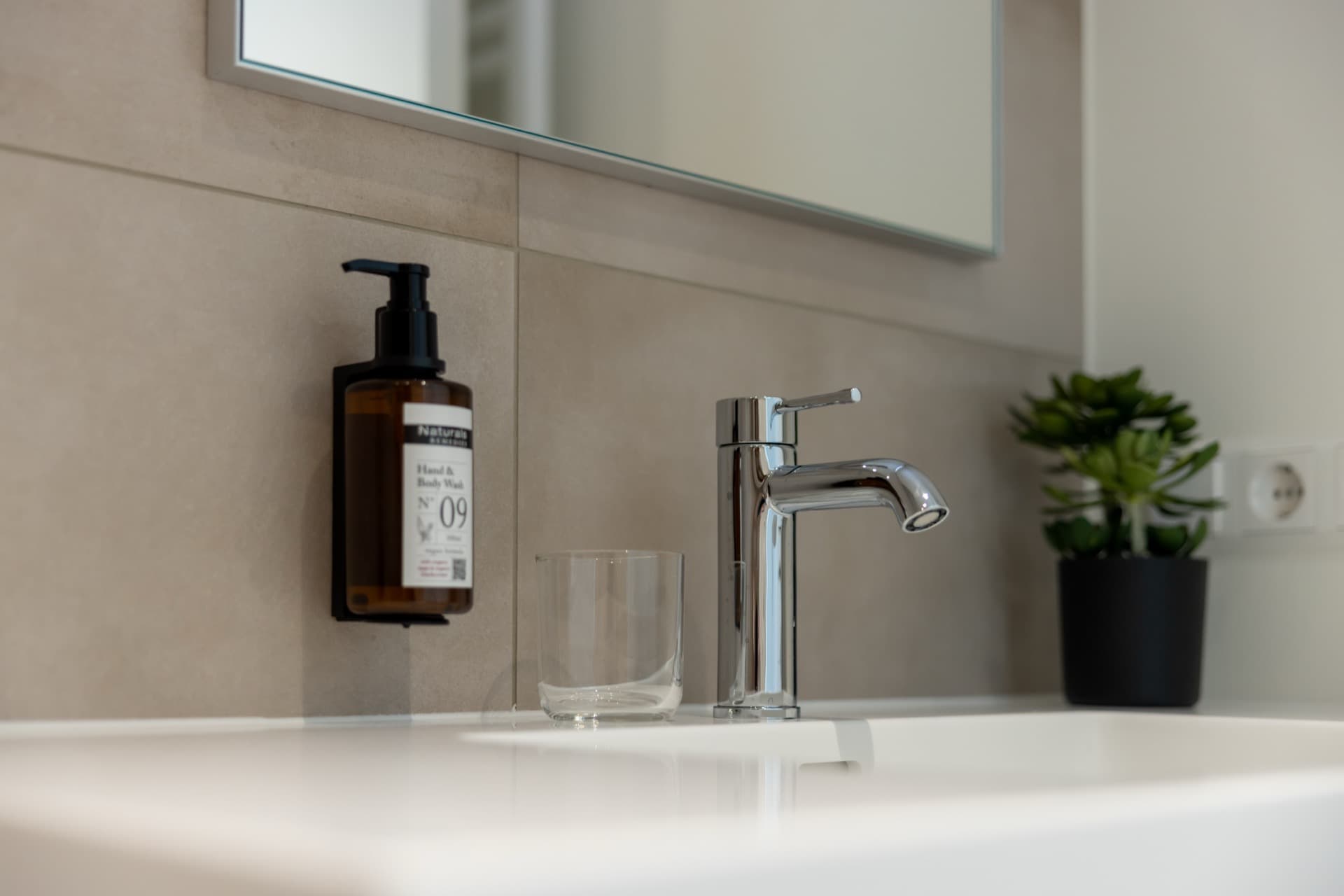 Close-up picture of the sink faucet and sanitizing products